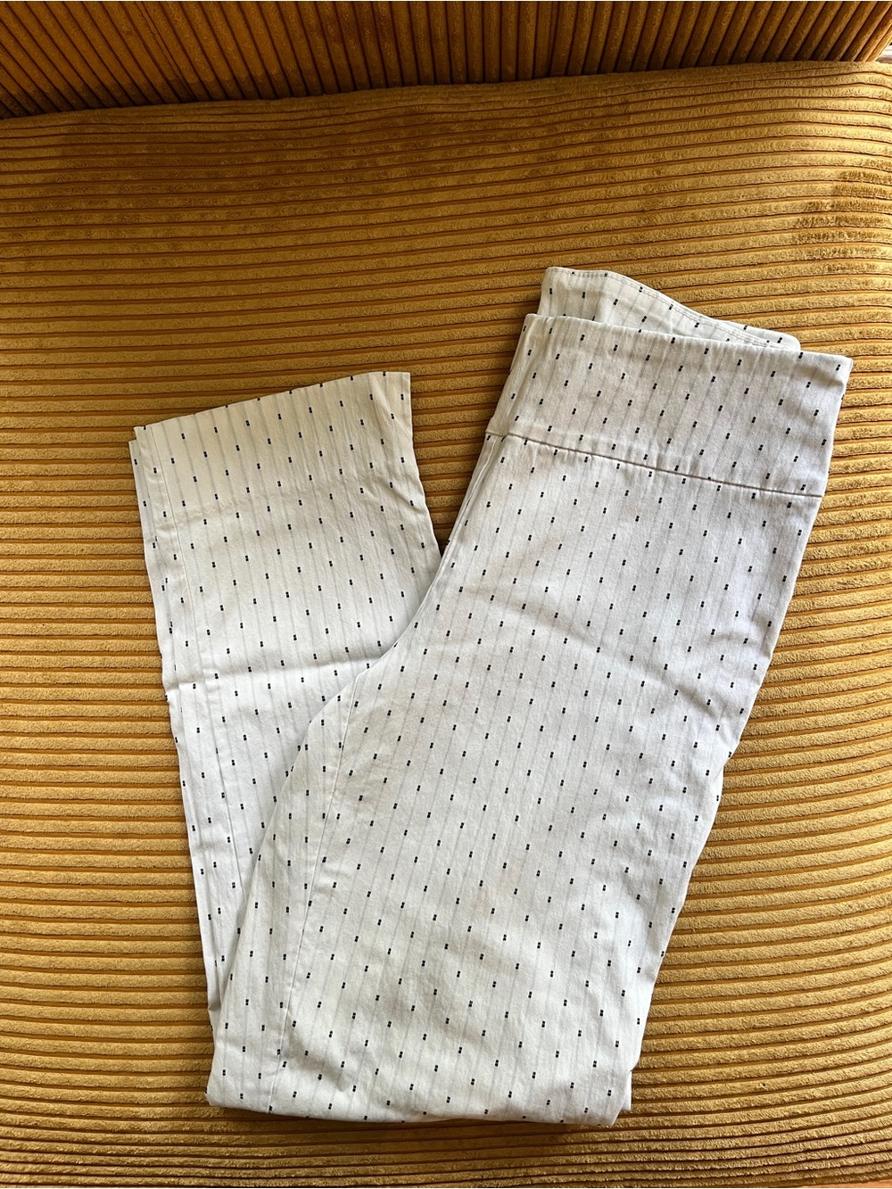 White pants with black micro dot pattern